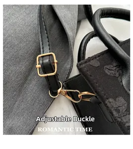 Detail of adjustable leather strap with premium gold metal buckle for floral handbag