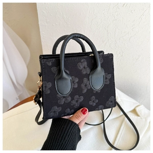 Mini black tote bag with 3D floral embroidery and versatile shoulder strap