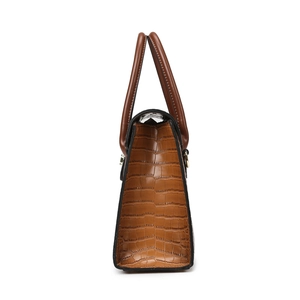Brown crocodile embossed handbag with sturdy double handles and golden hardware accents
