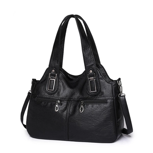 Minimalist black faux leather tote bag for women with dual handles and metal zipper details