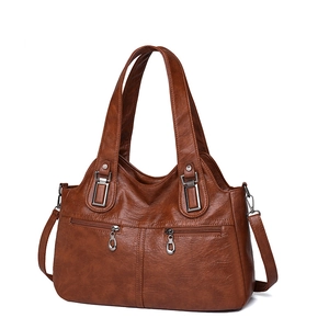 Brown soft leather tote bag for women with dual front zipper pockets and shoulder strap