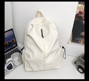 Detailed view of off-white backpack featuring a vertical zipper and side drawstring pockets