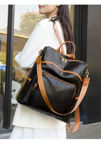 Detailed view of women's vintage patchwork backpack with gold zippers and side pocket