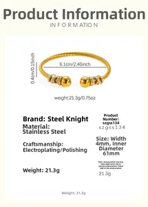 Detail view of 18k gold plated stainless steel twisted bangle with crystal ball ends