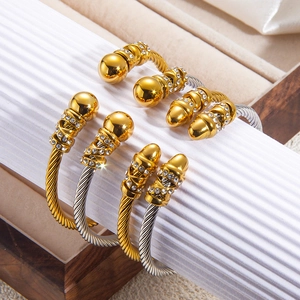 Twisted cable wire bangles in gold and silver with pave rhinestone studded bulb ends