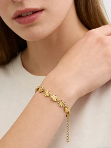 Detail view of 18k gold-plated heart-shaped links with radiant embossed sunray texture