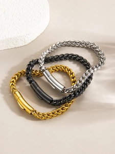 Ensemble de trois bracelets maille épi en or, argent et noir avec fermoir à ressort