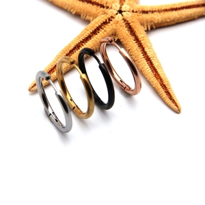 Set of four stainless steel hoop earrings in silver, gold, rose gold, and black finishes