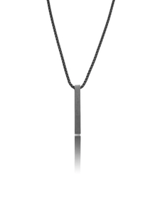 Detail view of matte black vertical bar pendant with minimalist box chain necklace