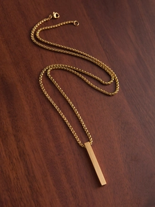 Polished gold bar pendant necklace on wood surface featuring a durable box chain