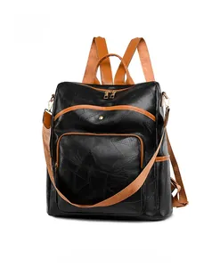 Side view of bicolor oxford fabric backpack with leather texture and spacious pockets