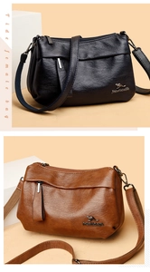 Détails de la texture du cuir grainé et du logo kangourou en métal sur le sac à main