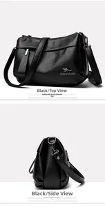 Détails d'un sac à main en cuir grainé noir avec des garnitures métalliques argentées