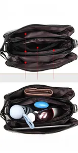Structure interne du sac noir motif litchi avec trois compartiments principaux