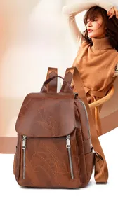 Detail view of large capacity brown retro backpack with waterproof PU leather texture