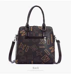 Detailed back view of the brown leather handbag showing a silver zipper pocket and logo print