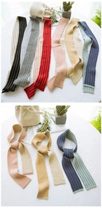 Detailed knit texture of slim striped scarves with polka dot jacquard patterns