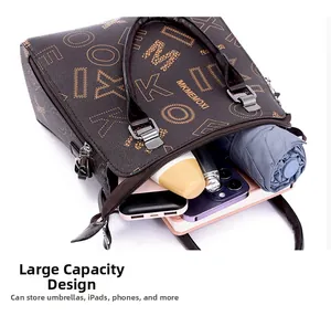 Top view of large capacity tote bag interior storing umbrella, phone, and notebook