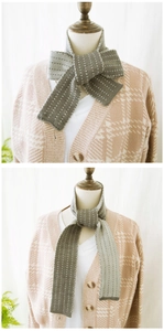 Detailed view of striped knit scarf showing two ways to tie grey and olive green bicolor neckwear