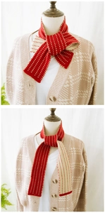 Detailed view of red and white striped knit scarf showing different knot styles