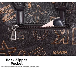 Close-up of functional back zipper pocket on brown printed leather tote bag with a phone