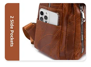 Detail of vintage brown leather backpack showing side pockets and stitched oil-wax texture