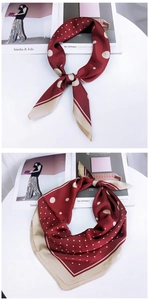 Gros plan sur un foulard en soie bordeaux élégant avec motifs à pois et patchwork