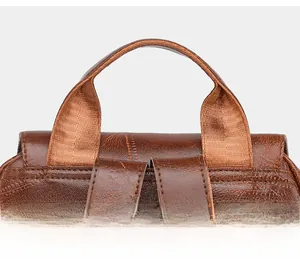 Detail of soft knit handle and vintage map pattern leather texture on travel backpack