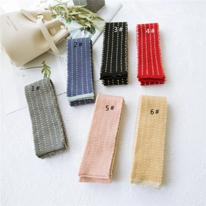 Striped knit scarf collection for women in various colors with white dotted texture