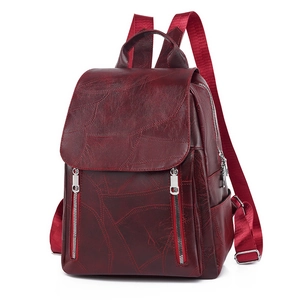 Minimalist burgundy faux leather women backpack with stylish geometric textured paneling