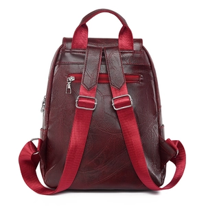 Burgundy faux leather backpack with leaf pattern texture and red fabric straps