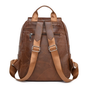 Deep brown vintage patchwork backpack with wide straps and anti-theft back pocket