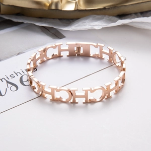 Polished rose gold spring cuff bracelet featuring hollow C and H letter links