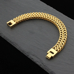 Men's double-row gold stainless steel curb chain bracelet on a black stone plate