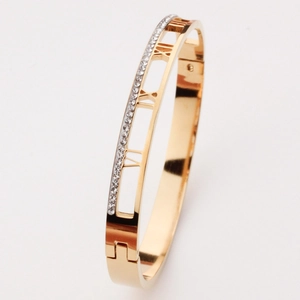 Elegant rose gold titanium bangle with Roman numeral cutouts and sparkling diamonds