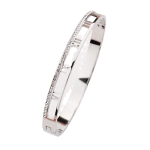 Silver stainless steel bangle featuring roman numeral cutouts and sparkling pave crystals