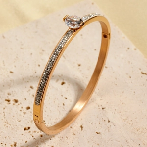 Elegant rose gold titanium steel bracelet with oval center diamond and micro-pave crystals