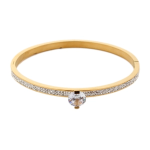 Detail of gold-plated bangle with a large round cubic zirconia and pavé-set crystals
