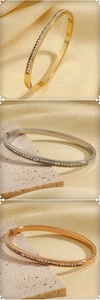 Detailed view of luxury minimalist hinged bracelets in gold, silver and rose gold finishes