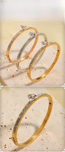 Detailed display of three-tone titanium steel hinged bracelets with sparkling crystals