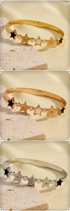 Detailed trio of stainless steel bangles with star charms in gold, silver, and rose gold