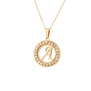 Detailed view of golden pendant necklace with letter A and sparkling crystals