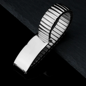 Minimalist silver stainless steel stretch watch band bracelet on dark stone background