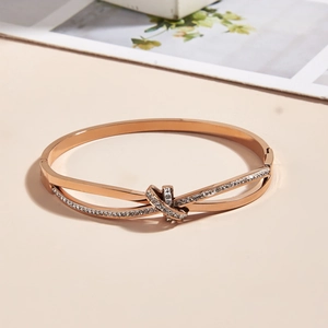 Elegant rose gold plated stainless steel knot bracelet with sparkling cubic zirconia crystals