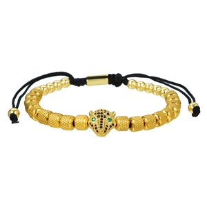 Close-up of leopard head charm with green zircon eyes on beaded adjustable bracelet