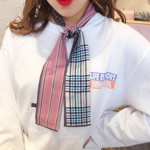 Detail showing high-quality polyester silk scarf with blue check and pink stripe pattern