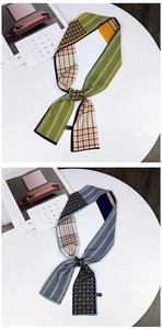 Close-up of dual-sided twilly scarves with polka dots, stripes, and checkered patterns