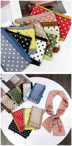 Detailed view of polka dot pattern and colorful stitching on long polyester scarves