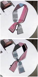 Detail of two-piece double-sided silk scarves with geometric patterns and ring buckles