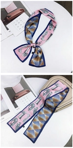 Detail of pink and navy silk scarf with giraffe print and geometric diamond texture